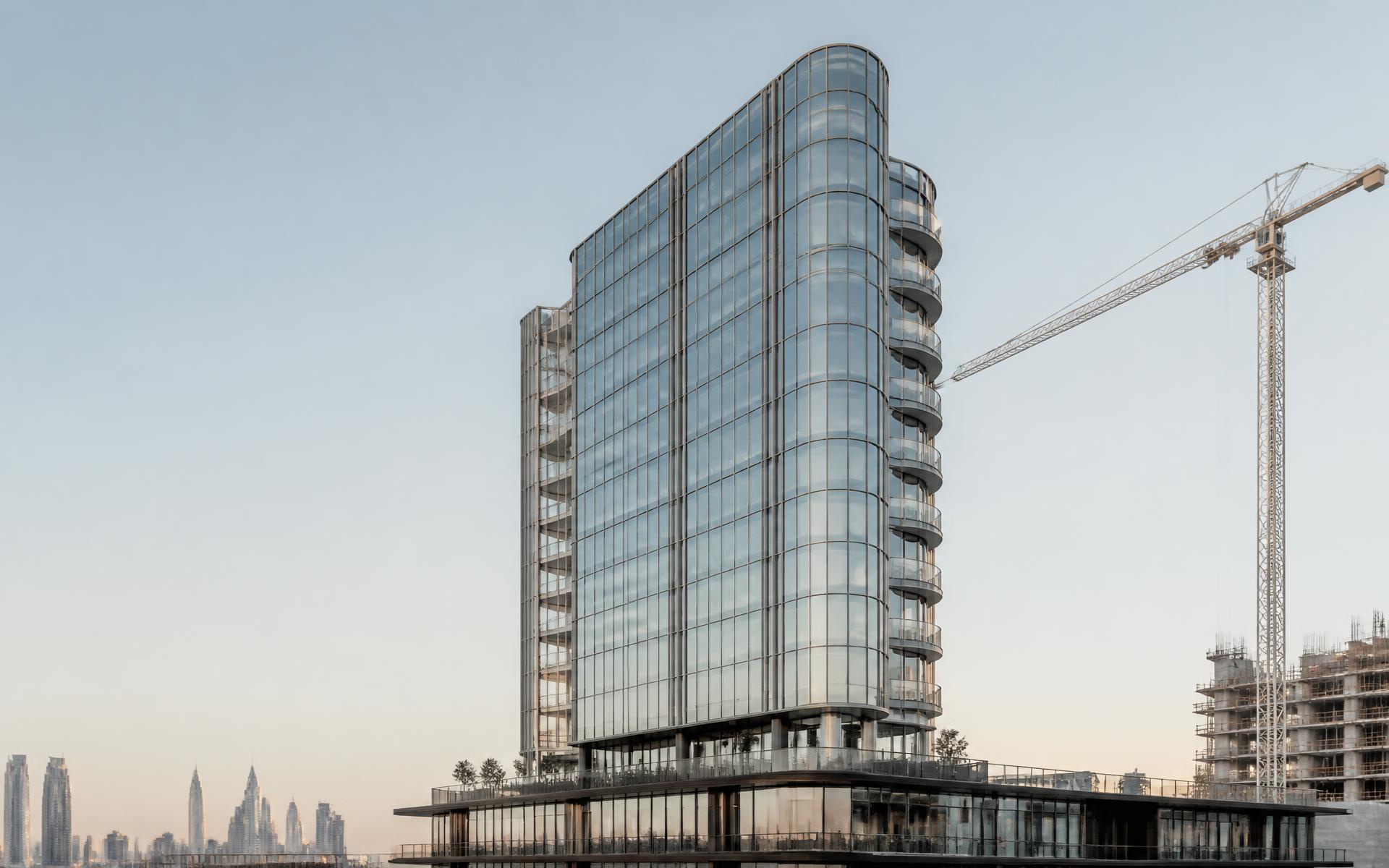 Modern high-rise tower under construction at sunrise